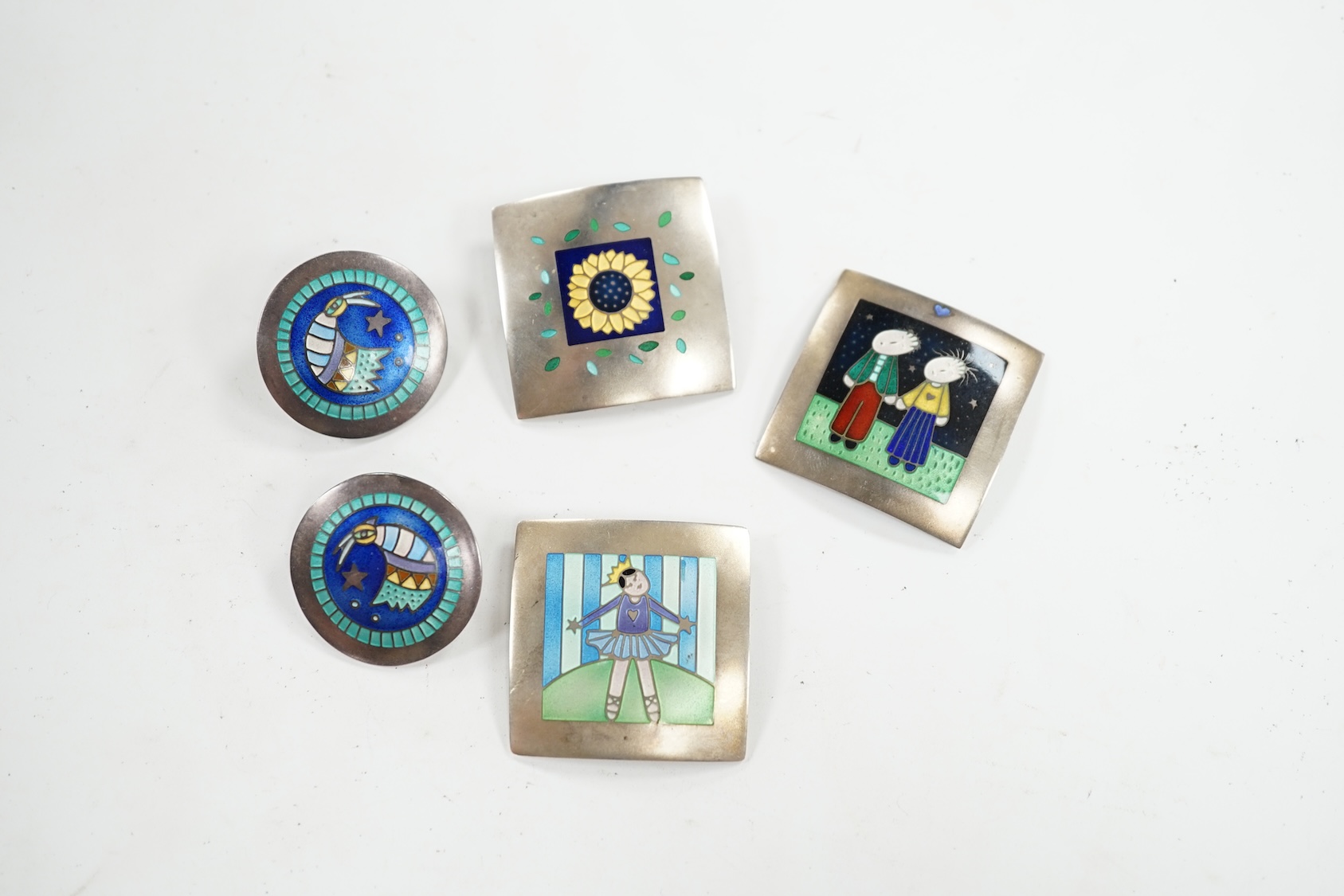 Two modern Jane Moore silver and enamel square brooches, 35mm and a similar Jane Moore pendant, together with a pair of similar earrings, maker JLB. Condition - fair